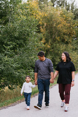 Young family walking in the park