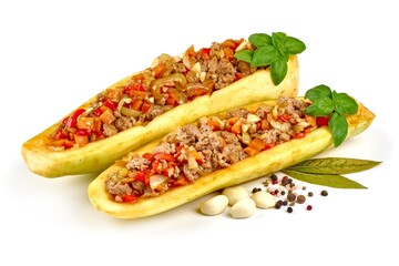 Zucchini halves stuffed with minced meat and vegetable, isolated on white background