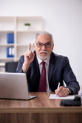 Old male employee and too much work in the office