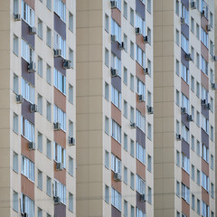 Windows on the facades of high-rise apartment buildings, close-up