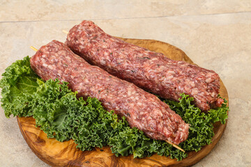 Raw minced beef kebab skewer