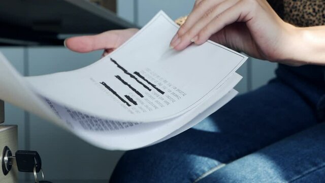 Hands open the closet and take information on a top secret document containing classified information