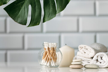 spa concept with cosmetic products on table in the bathroom