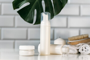 cosmetic containers for skin care on a white table background. Organic spa beauty products