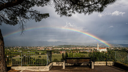rainbow over the town of Pescantina seen from Bussolengo