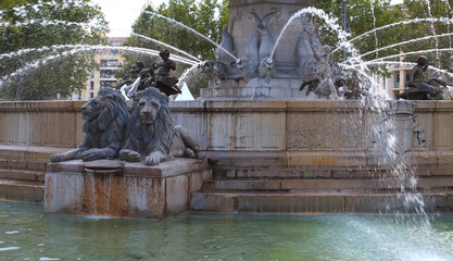 Two lions, detail of the Rotonde fountain  in the city center of Aix-en-Provence,