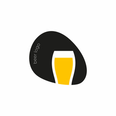 Beer logo. Logo for a beer shop, restaurant, bar. A glass of beer on the background of a black oval with the inscription 