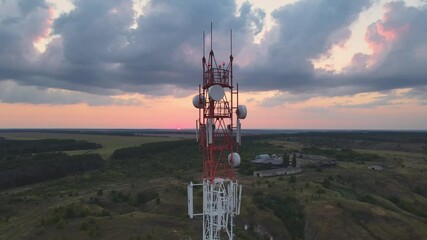 Telecommunication tower 5G Antenna at sunset. Connection system of communication systems in countryside.