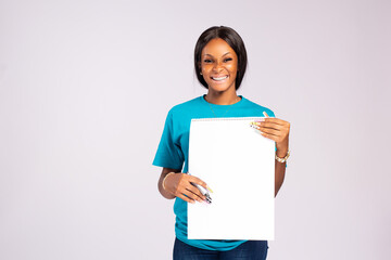 beautiful african lady holding and empty notepad