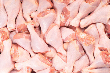 Fresh chicken leg with skin many pieces close-up for a supermarket, retail. Raw chicken meat.