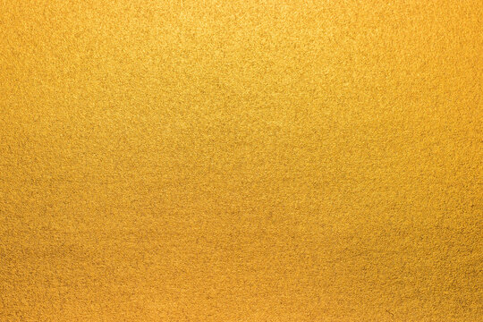 Soft gold background texture, subtle textured golden paper