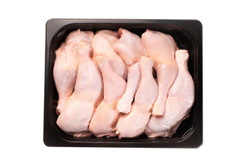 Fresh chicken leg with skin many pieces close-up in plastic packaging for supermarket, retail. Raw...