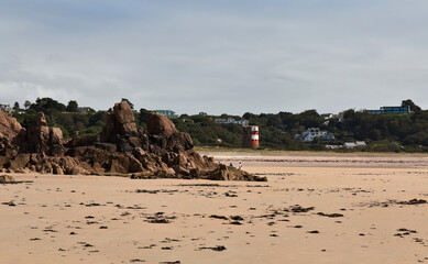 rocky beach and tower - St. Brelades Bay in Jersey