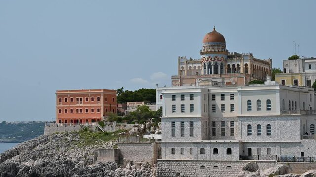 Footage on the sea landscape of Santa Cesarea Terme, Puglia, Italy. August 2021. On a magnificent summer day, the Ottoman-style villa sticchi stands out on the profile of the coast.