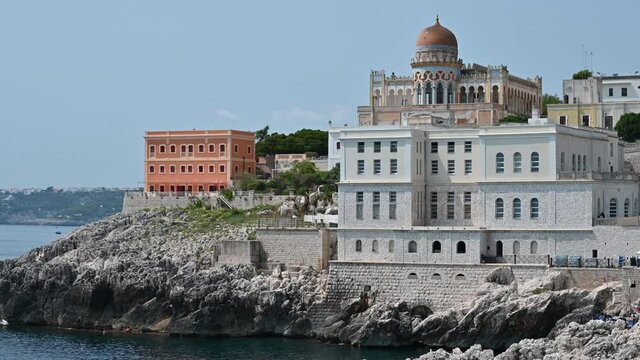 Tilt footage on the sea landscape of Santa Cesarea Terme, Puglia, Italy. August 2021. On a magnificent summer day, the Ottoman-style villa sticchi stands out on the profile of the coast. 