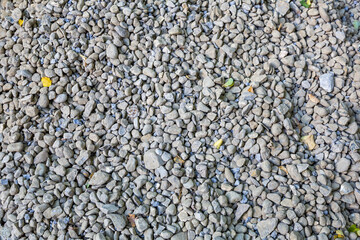 Textured surface of a heap of rough gravel at a construction site