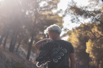 a young gay man skating on in-line skates.