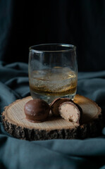 whiskey glass with chocolates in an elegant setting