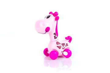 Pink clockwork giraffe on the white background