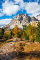 Dolomites, during the day to the Lagazuoi Mountains in the background of the beautiful Pelmo, Averau and Lastoi de Formin mountain peaks, near the town of Cortina d'Ampezzo, in the province of Veneto