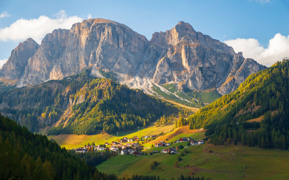 Corvara in Badia charming small Italian mountain village in the valley in the background Sassongher beautiful mountain, Province of Bolzano, Val Gardena, South Tyrol