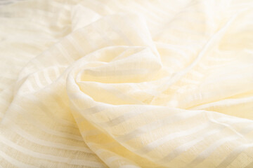 Fragment of white linen tissue. Side view, natural textile background.