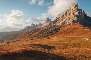 Fototapeta premium Famous Passo di Giau, Monte Gusela at behind Nuvolau gruppe the Dolomites mountains, near the famous Cortina d’Ampezzo city at sunset in South Tyrol