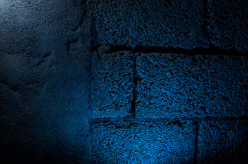 Stone wall dark background with light. Grunge style wall for background
