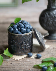 fresh blueberries with green leaves