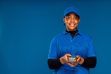 beautiful young african business staff holding a point of sale device