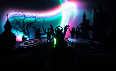 Scary view of zombies at cemetery dead tree, moon, church and spooky cloudy sky with fog, Horror Halloween concept. Toned