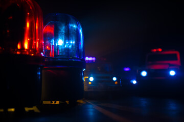 Police car blue and red round vintage siren in dark. Rotating retro style police siren in dark.