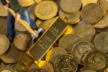 Industrial Engineering worker digging with gold bar and coin as business and industry concept....