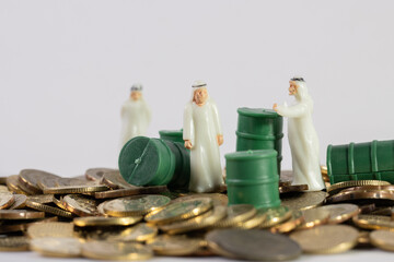 Stack Image of Coins with oils barrel. Crude oil commodity trading in price crisis situation.