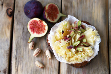 Cheese tet de moine with figs and pistachios.