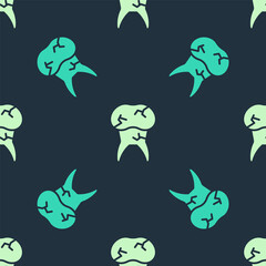 Green and beige Tooth with caries icon isolated seamless pattern on blue background. Tooth decay. Vector