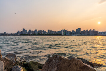 Fototapeta premium View of downtown Montreal city skyline and Saint Lawrence River at sunset, Quebec, Canada.