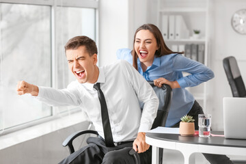 Happy colleagues having fun in office