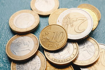 Golden coins on dark background, closeup