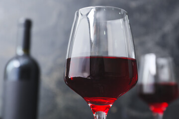 Glass of red wine on dark background, closeup