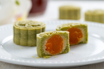Matcha green tea mooncake with white bean and egg yolk filling, a kind of traditional Chinese snack for mid autumn festival
