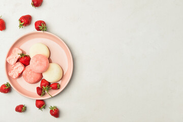 Obraz na płótnie Canvas Plate with tasty Japanese mochi and strawberry on light background