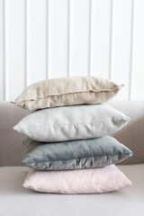 Fototapeta na wymiar Minimal linen cushion covers on a sofa