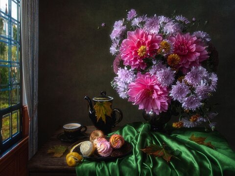Still life with bouquet of autumn flowers on coffee table