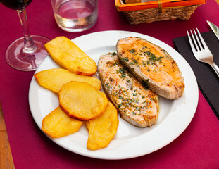 Image of deliciously steak of baked salmon with potatoes on plate