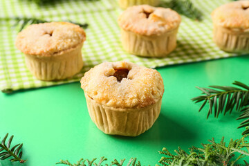 Tasty mince pie on color background