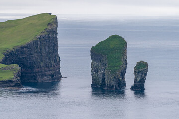 Beautiful aerial view of Drangarnir, the sea stacks between the islet Tindholmur in the Faroe Islands