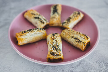 vegan sausage rolls with beans and mixed veggies with seeds topping, healthy plant-based food