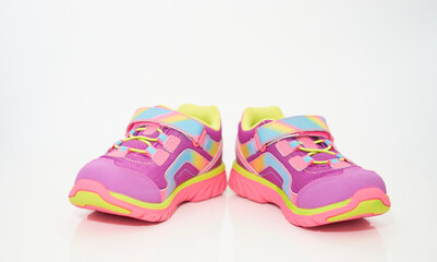 color kid  sneakers shoes on floor front view soft focus