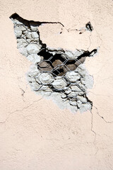 Damaged stucco wall finish close-up